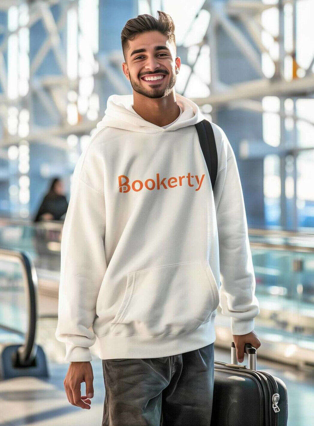 Smiling man with glasses wearing a bookerty hoodie.